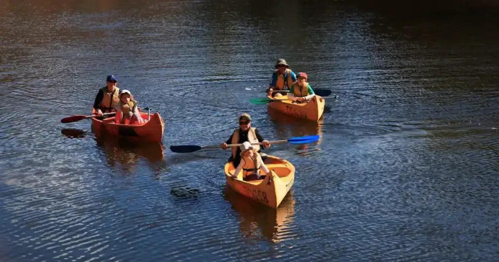 Things to Do in Kalbarri: Must-Sees & Hidden Gems from a Local 24 three travellers in yellow canoes paddling along the river in kalbarri