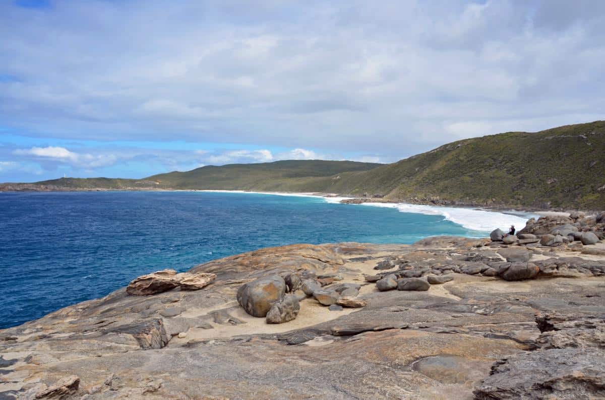 huge rocky headland with views of a sandy bay at blow holes albany