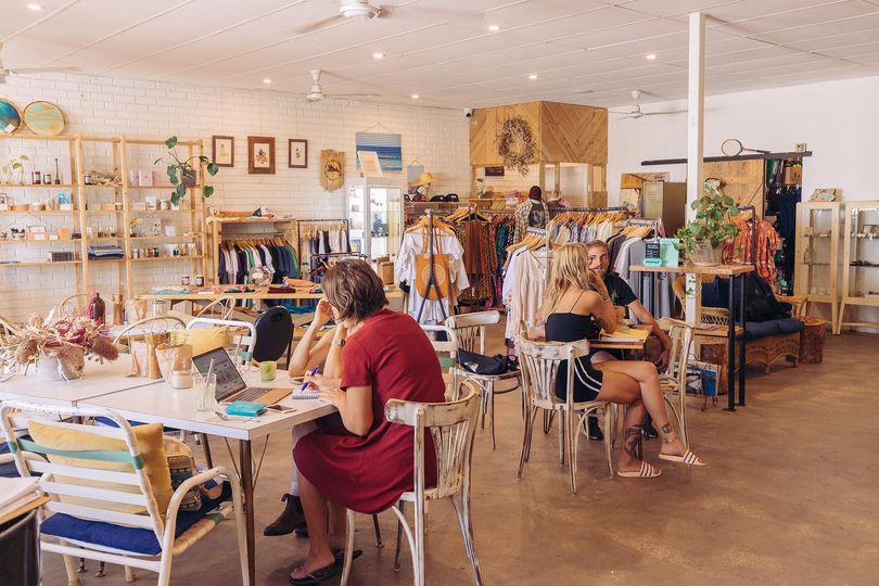 people sitting in a cafe in exmouth drinking coffee