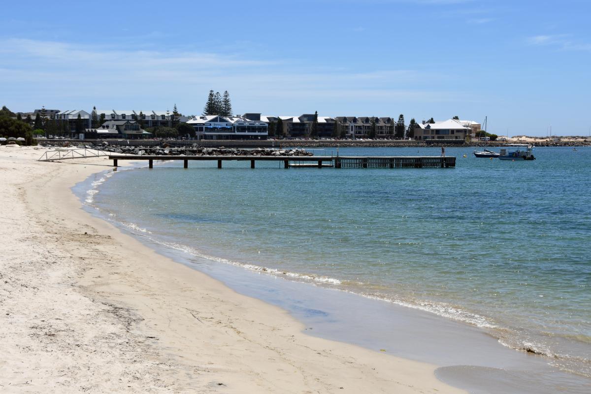 a bay with a jetty going out into the ocean