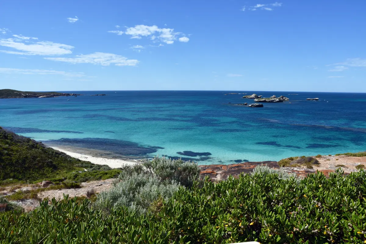 coastline with the ocean different colours of blue and islands out at sea