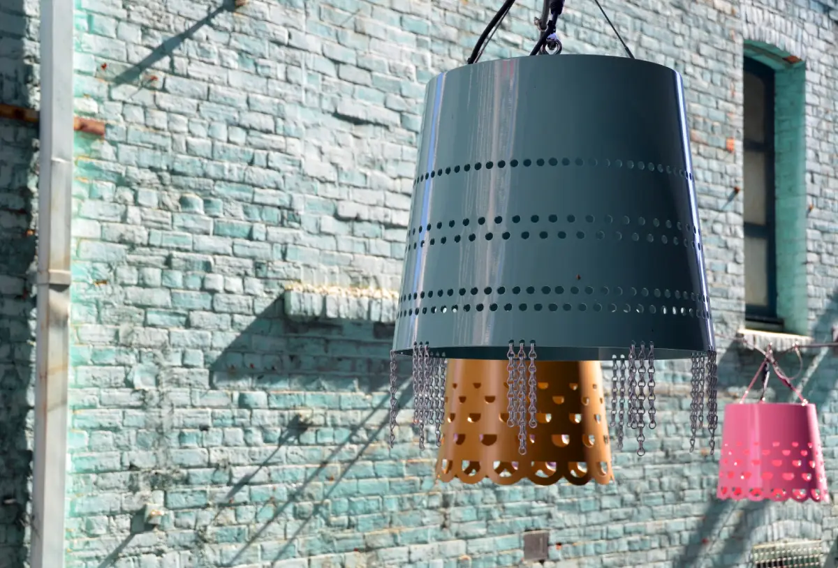 laneway with light fixtures that look like buckets