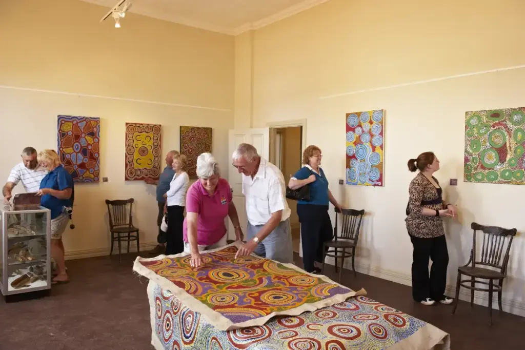 people looking at australian indigenous art at Art Gallery within the Menzies Visitor Centre