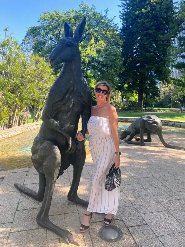 wendy white standing next to a statue of a kangaroo in perth western australia