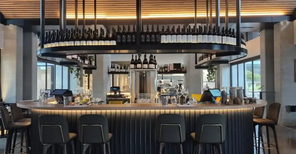 Best Wine Tours in Margaret River: Top Tours Compared (Plus Tips for Choosing the Right One) 5 the bar at vintners wine bar with bottles of wine