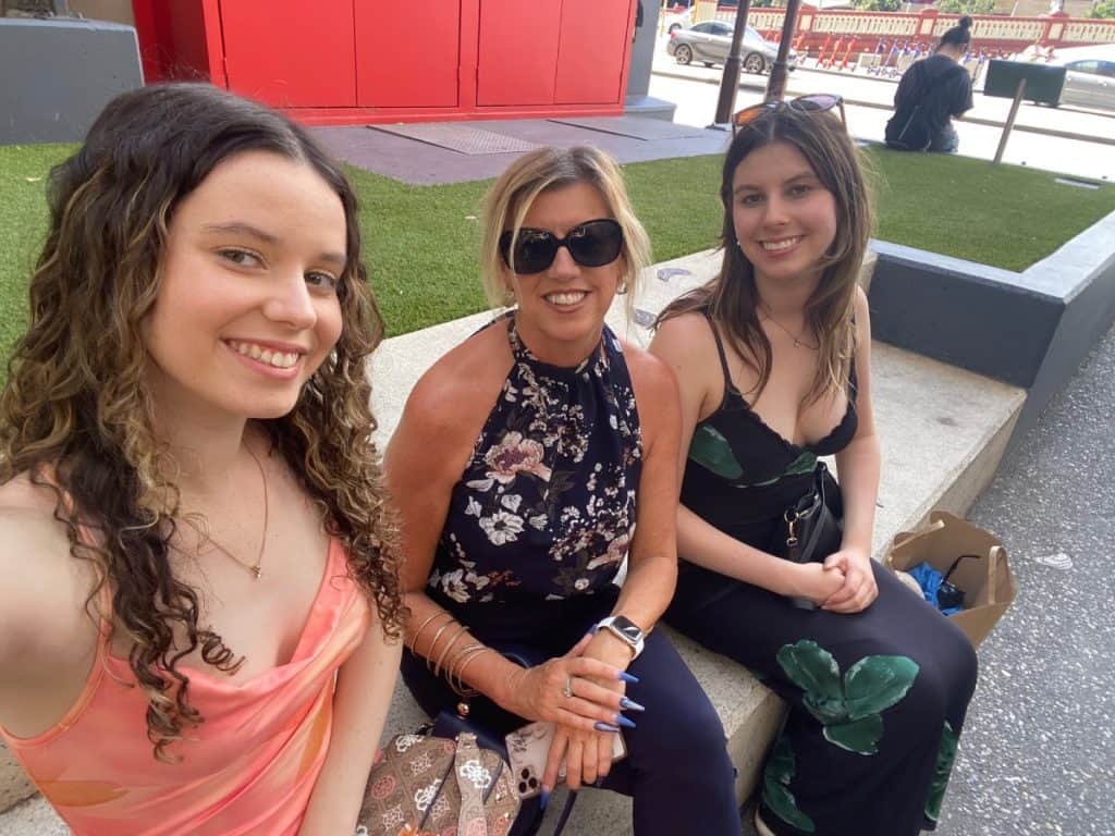 About Western Australia Expert 3 Wendy white sitting with her twin daughters in Perth Western Australia